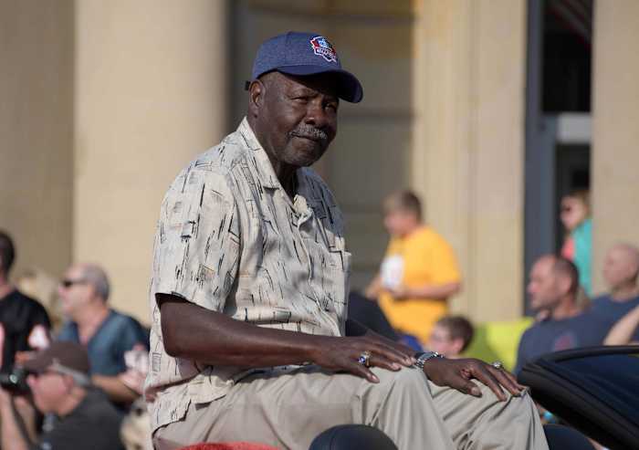 Former Chiefs defensive back Emmitt Thomas acknowledges the crowd during the 2018 Pro Football Hall of Fame Grand Parade on Cleveland Avenue.